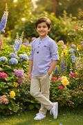 Boy 5-6 years in garden wearing lavender Chinese collar shirt