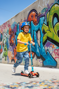 Boy on scooter wearing graphic cargo jeans