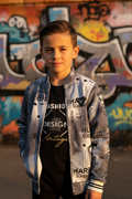 Boy wearing bomber jacket and t-shirt - street style