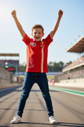 Boy wearing Ferrari racing t-shirt - victory pose