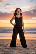 Girl in black co-ord set - beach sunset