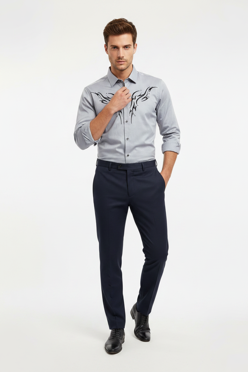 Male model wearing grey abstract pattern shirt untucked with dark trousers
