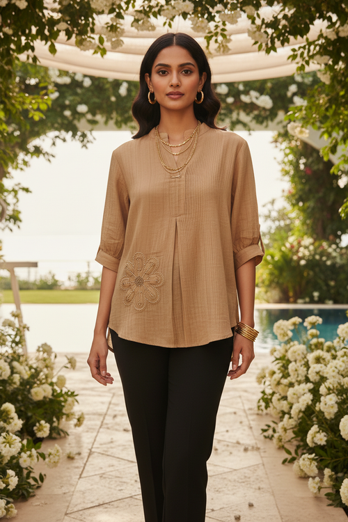 Indian model wearing tan camel mandarin collar beaded top