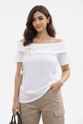 Model wearing Off-Shoulder Bow Crop Top in White