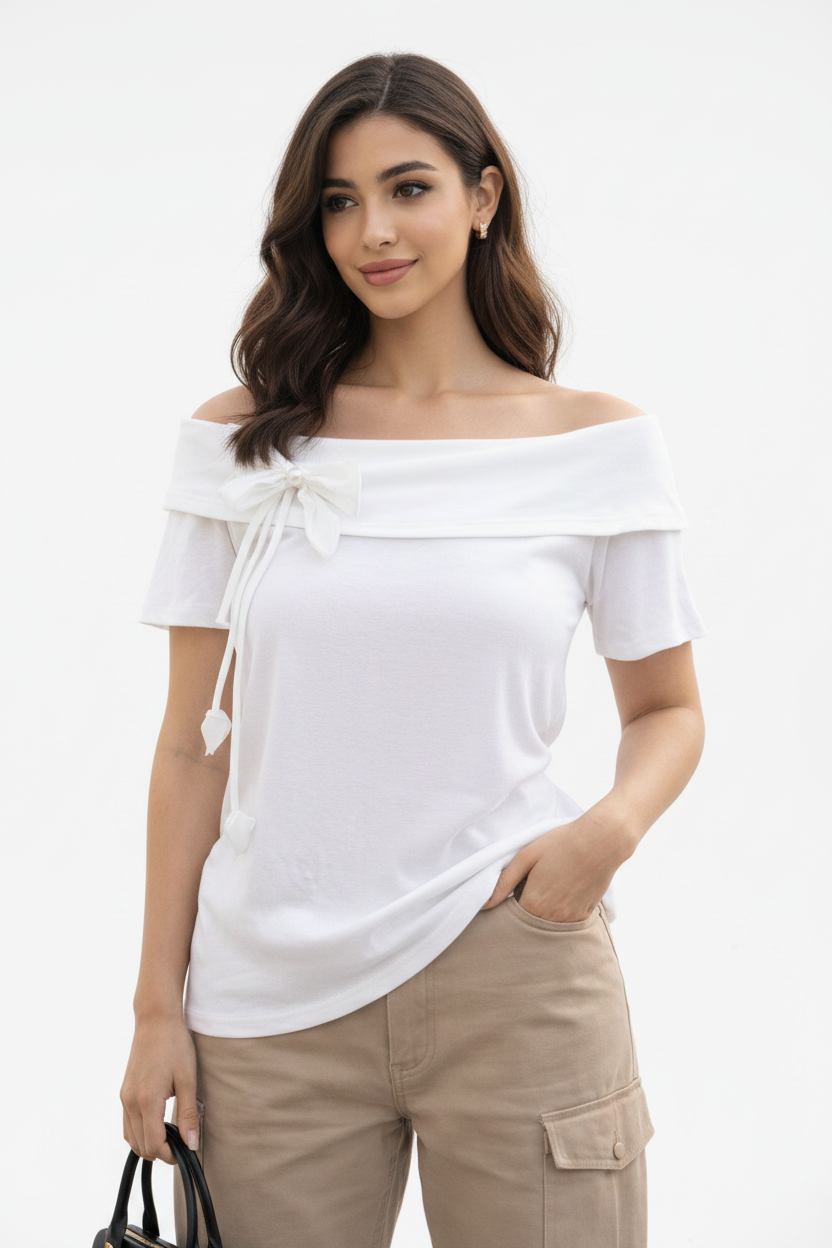 Model wearing Off-Shoulder Bow Crop Top in White