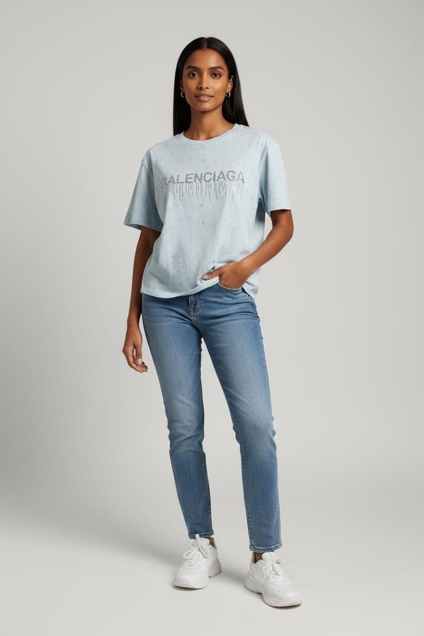 Indian model wearing blue rhinestone drip graphic tee