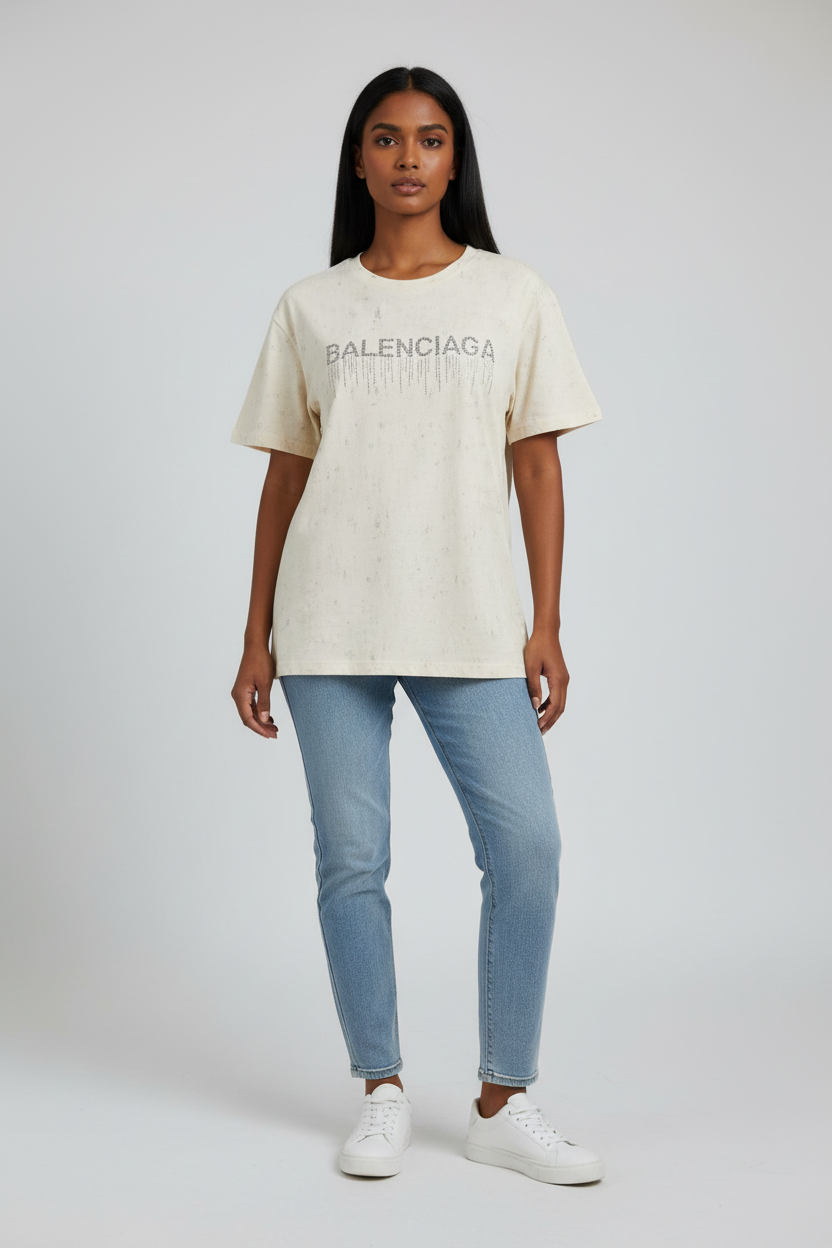 Indian model wearing cream rhinestone drip graphic tee
