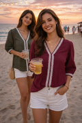 Indian model wearing burgundy boho lace trim top at beach sunset