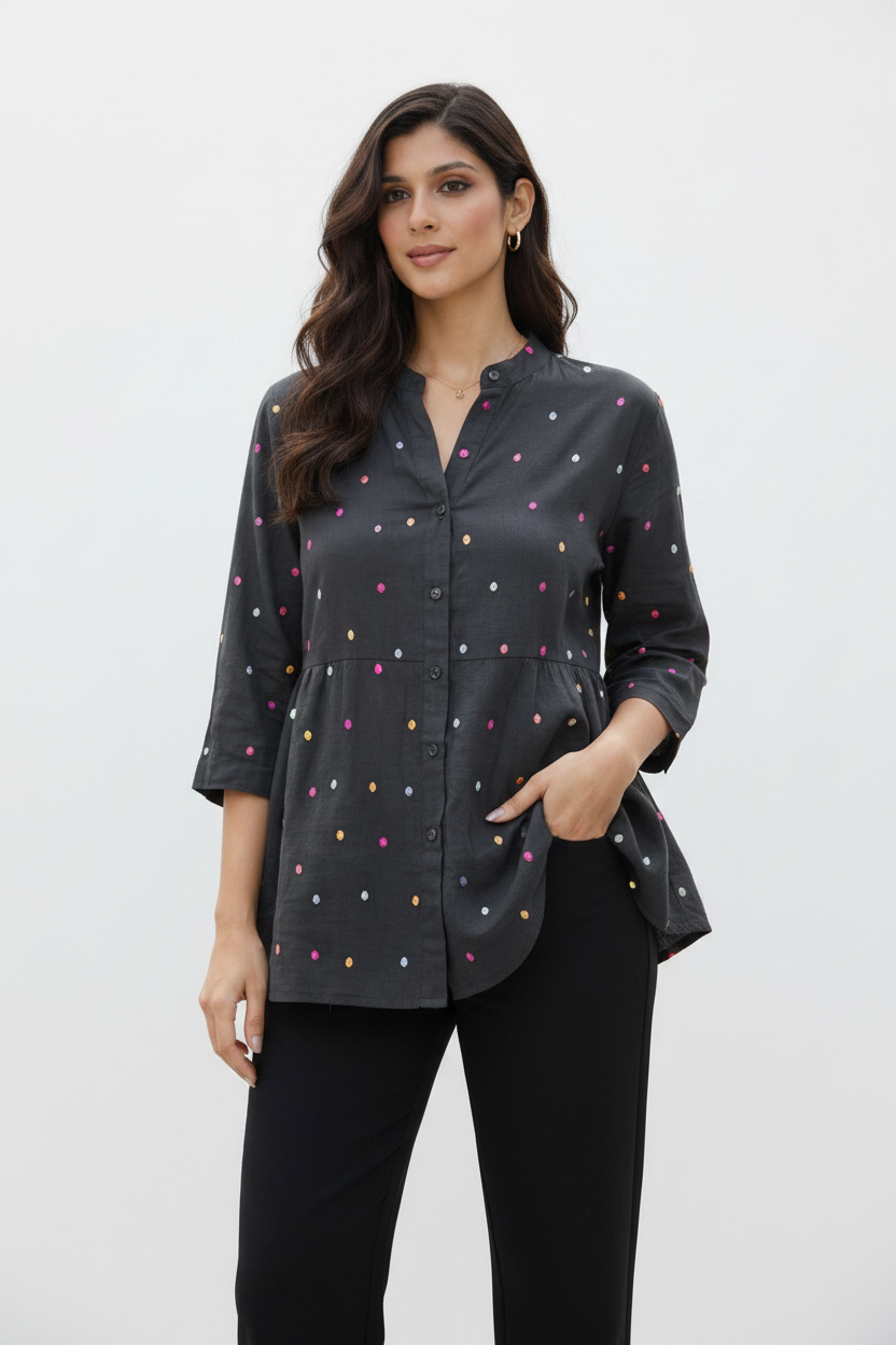 Indian model wearing charcoal polka dot embroidered peplum blouse