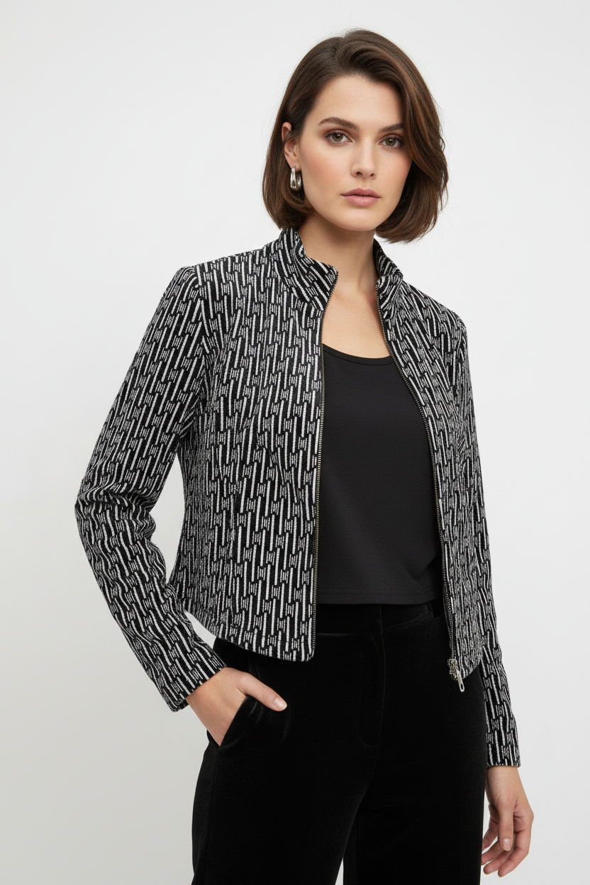 Model wearing black and white geometric velvet jacket and sleeveless top two-piece set