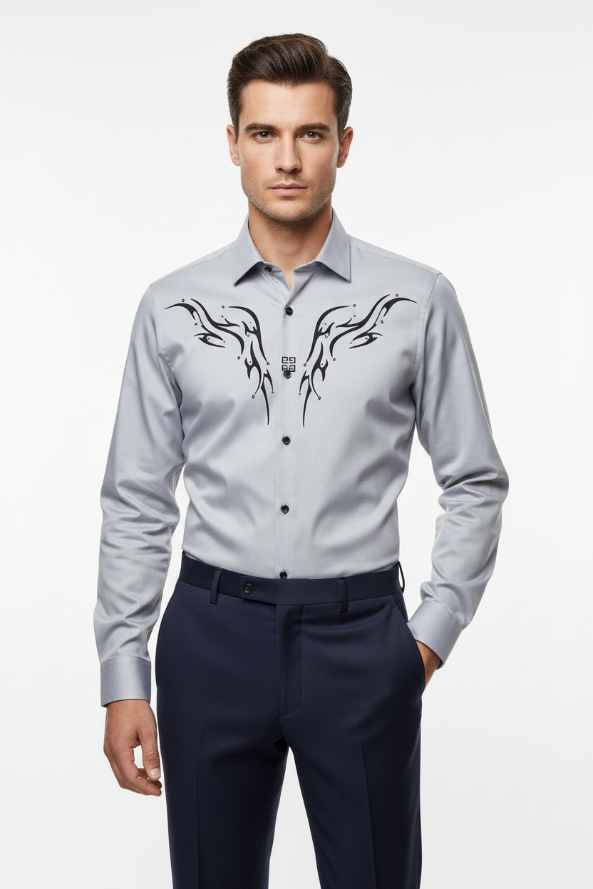 Male model wearing grey abstract pattern shirt tucked into dark trousers